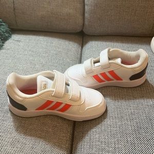 Kids Adidas white leather with bright orange stripes. Size 10